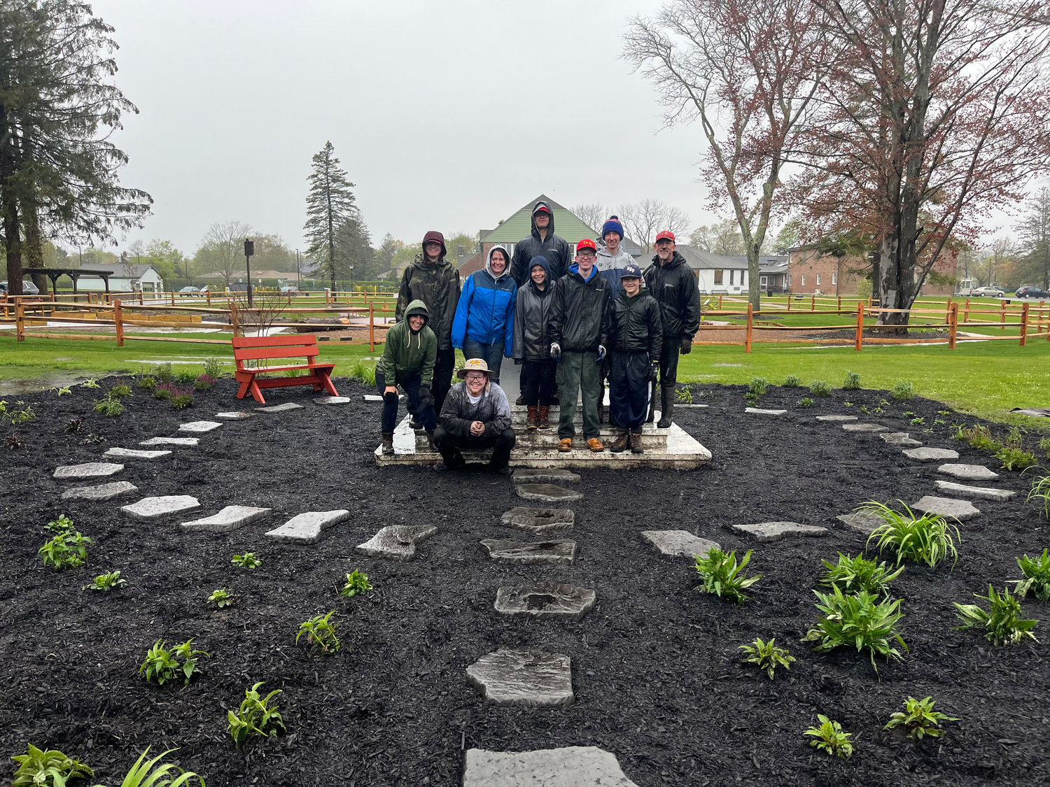 Nasca and volunteers take a break from the construction of the butterfly garden.